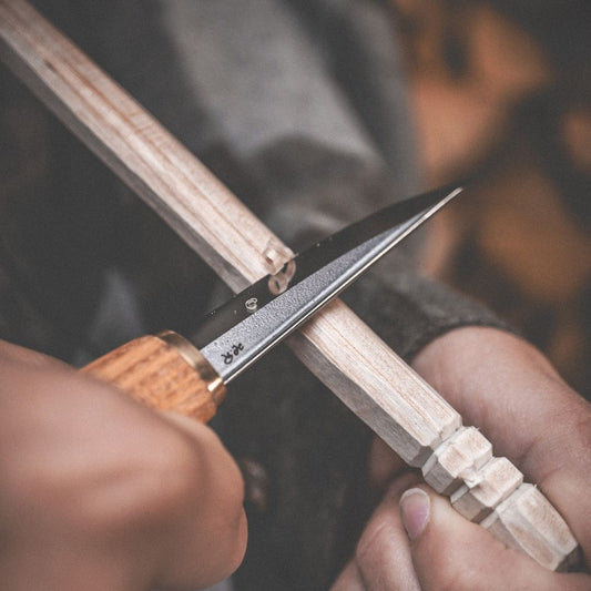 Rosellis Finnish handmade carving knife with a carbon steel blade and a handle of red elm.