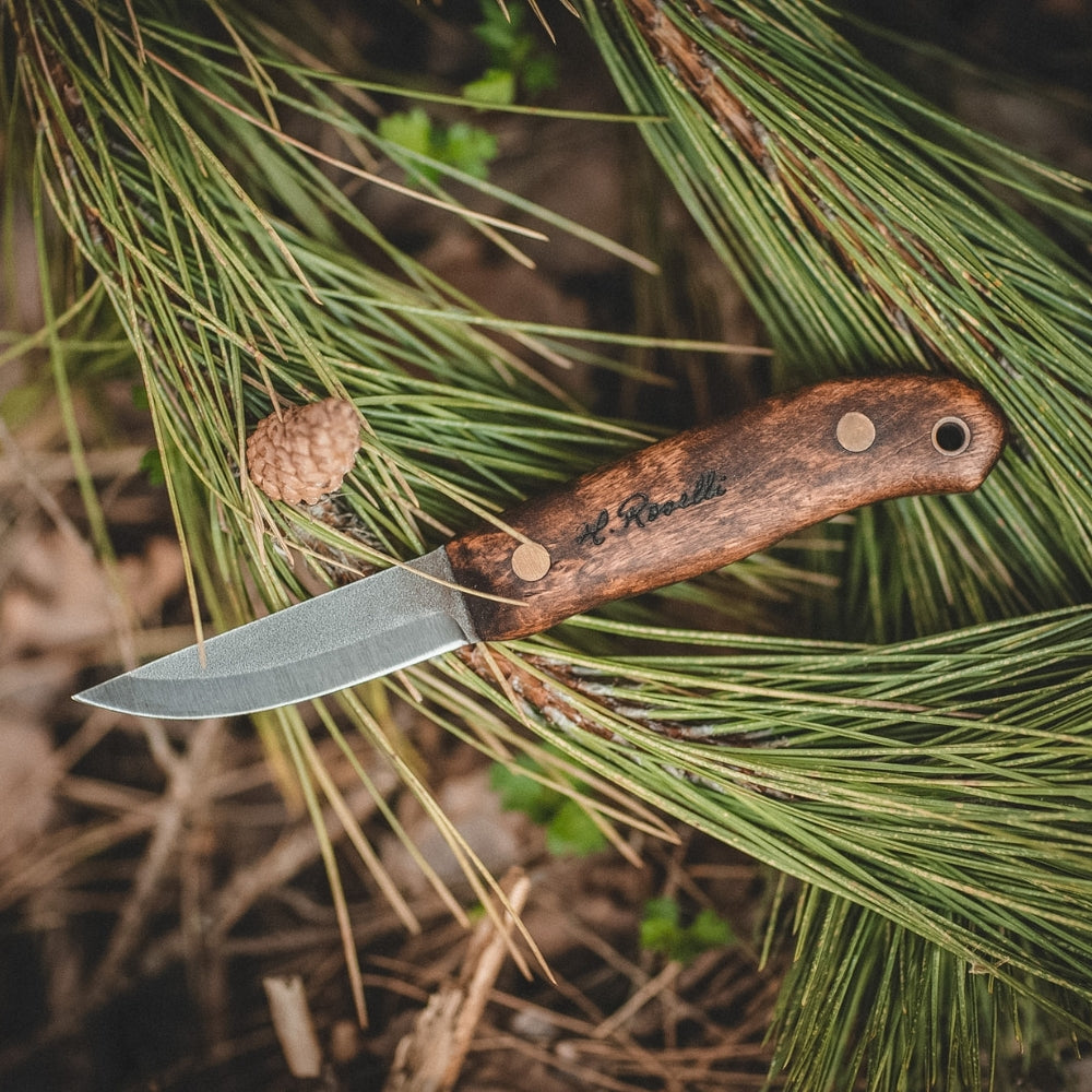 Rosellis handmade Finnish outdoor knife with a full tang blade. Based on our Carpenter knife. Stained curly birch handle and handmade leather sheath. 