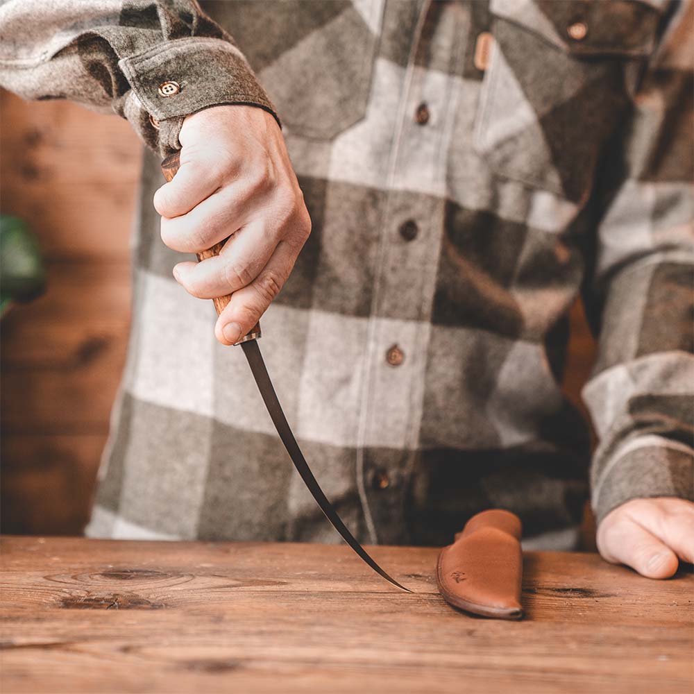 Roselli's handmade fillet and fishing knife with a long blade of carbon steel. This shows the flex of the blade
